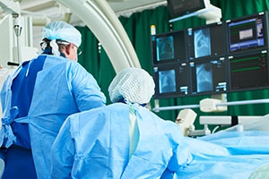 Cardiologists performing angioplasty