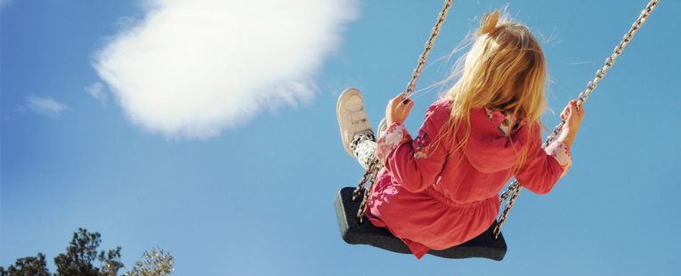Young girl on a swing