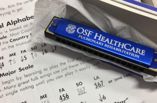 OSF HealthCare harmonica therapy instrument and sheet music
