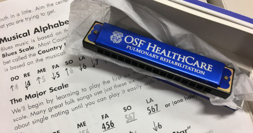 OSF HealthCare harmonica therapy instrument and sheet music