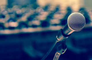 microphone at a podium in an empty hall