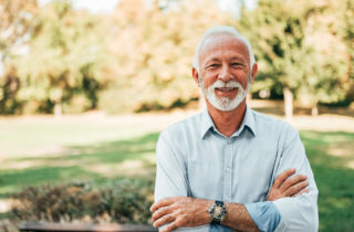 Senior man smiling in a park