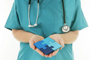 physician with puzzle pieces