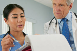 APRN and Physician consult on a patient record.