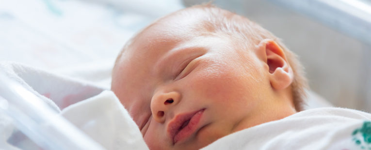 newborn sleeping in hospital birthing center