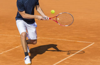 young athlete playing tennis