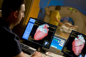 OSF HealthCare Cardiovascular Institute technician performing a scan of a heart patient.