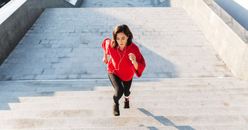 woman excersising by climbing stairs