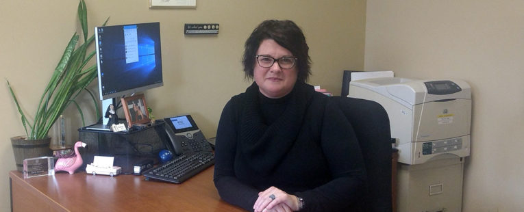 Cherie Reynolds with OSF HealthCare Foundation at work in her office