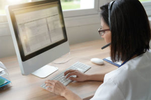Virtual Advanced Care clinician working at a computer