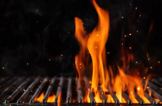 Flames on a bbq grill.