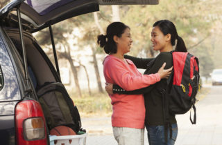 Asian-American mother dropping off daughter at college.