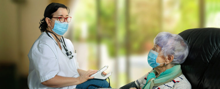 Home health care worker with senior patient.