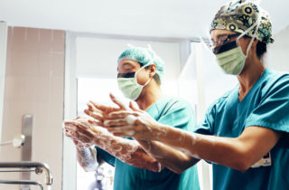 Two surgeons washing hands prior to elective surgery