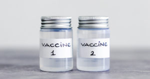 covid-19 vaccine against the pandemic, ampoules with Vaccine 1 and Vaccine 2 labels side by side referring to either the first and second shot or different vaccine options