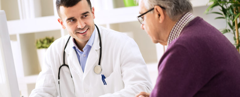 Man talking to doctor about care plan