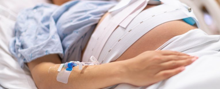 A woman in the hospital is getting induced for labor.
