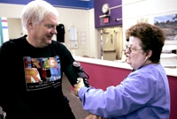 Cardiac rehabilitation therapist working with patient