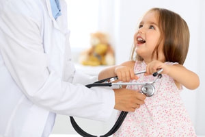 Pediatrician with girl
