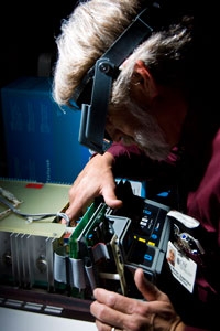 Equipment Technician Repairing Medical Equipment