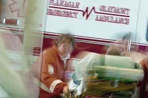 EMS technicians with patient in ambulance