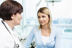Woman talking with doctor