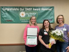 Congratulating Becky Palmer, 2022 DAISY Award winner are Deb May-Rickard, chief nursing officer (left), and Jackie Kernan, president (right)