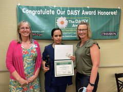 Congratulating Lorena Jaramillo, 2022 DAISY Award winner are Deb May-Rickard, chief nursing officer (left), and Jackie Kernan, president (right)
