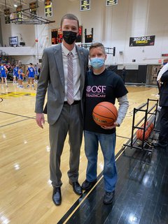 Coach Chad Thompson and Dr. Craig Wilson supporting breast cancer awareness at the Galesburg High School Basketball game.