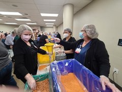 Mission Partners packing meals