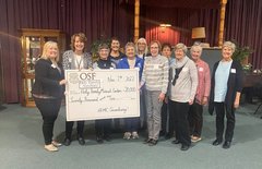 OSF Holy Family Auxiliary presents check to OSF HealthCare Holy Family Medical Center