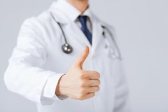 Provider holding a "thumbs up"