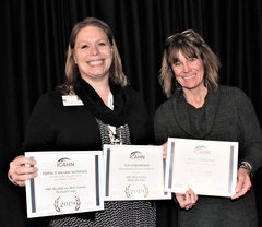 Amber Wood, Community Relations Coordinator, for OSF HealthCare Holy Family Medical Center, accepts awards for her hospital’s top performance in quality measures from Angie Charlet, ICAHN’s senior director of Quality, Education, and Compliance.