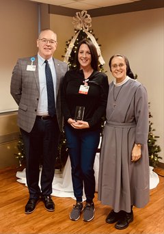 Pictured from left to right: Jerry Rumph, president; Keely Nelson, ICU nursing manager; Sister M. Beata Ziegler, vice president of Support Services for OSF HealthCare Saint Anthony’s Health Center.