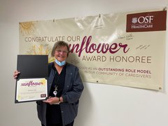Photo of Melody Fuller accepting her Sunflower Award.