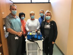 Pictured with the new breath alcohol testing equipment is Scott Hartman, vice president of Support Services, Tree of Lights Committee members, Pam Hanson, Kristi Warren, Deb Kirley and Renee Turczyn, Laboratory Services manager.
